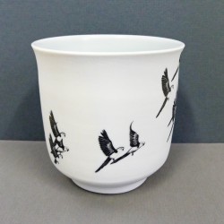 White porcelain cup parrots