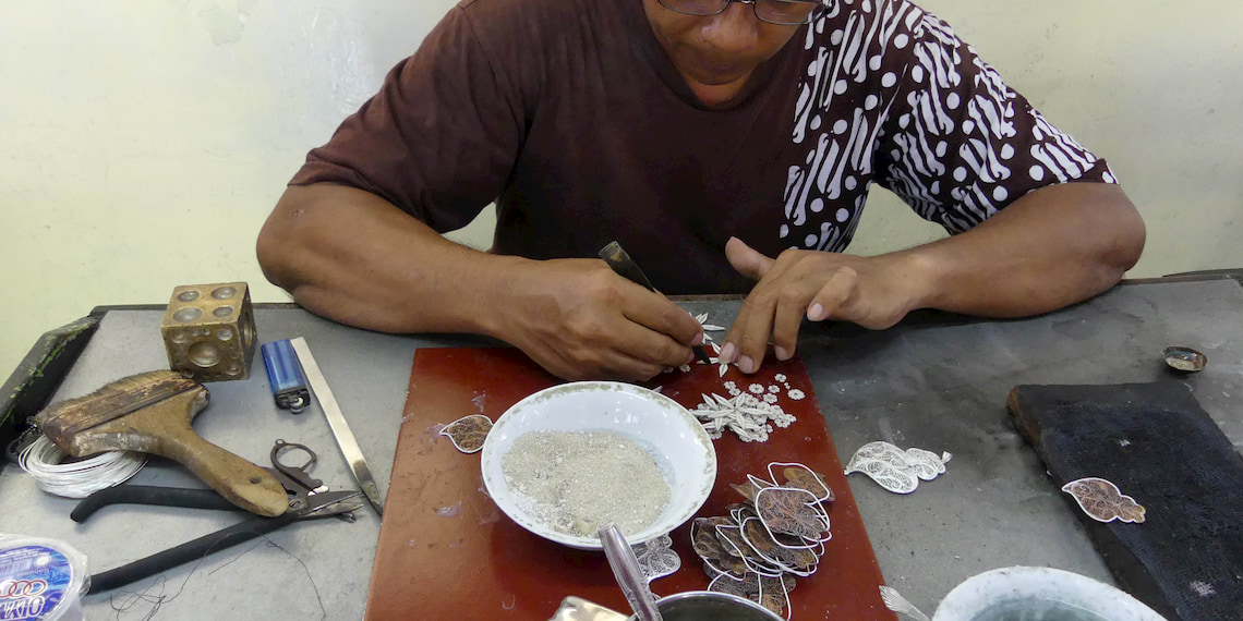 craftman soldering a jewel